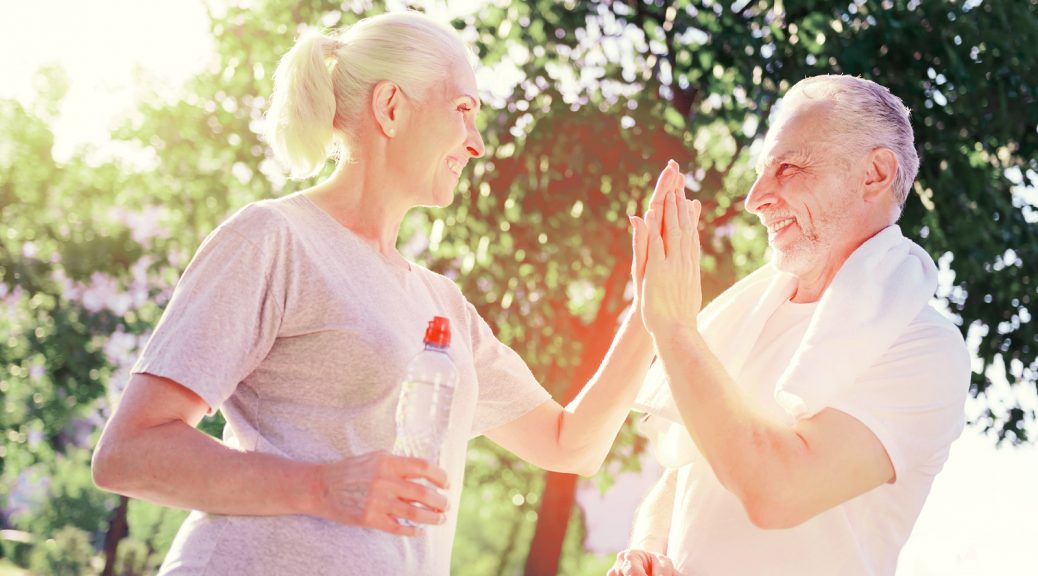 Two Older People High Fiving